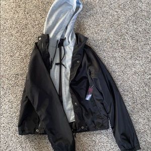 Black windbreaker with grey hoodie attached